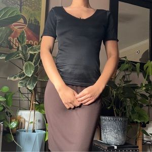 Cuddl Duds black top with lace trim and a bow in the middle size small